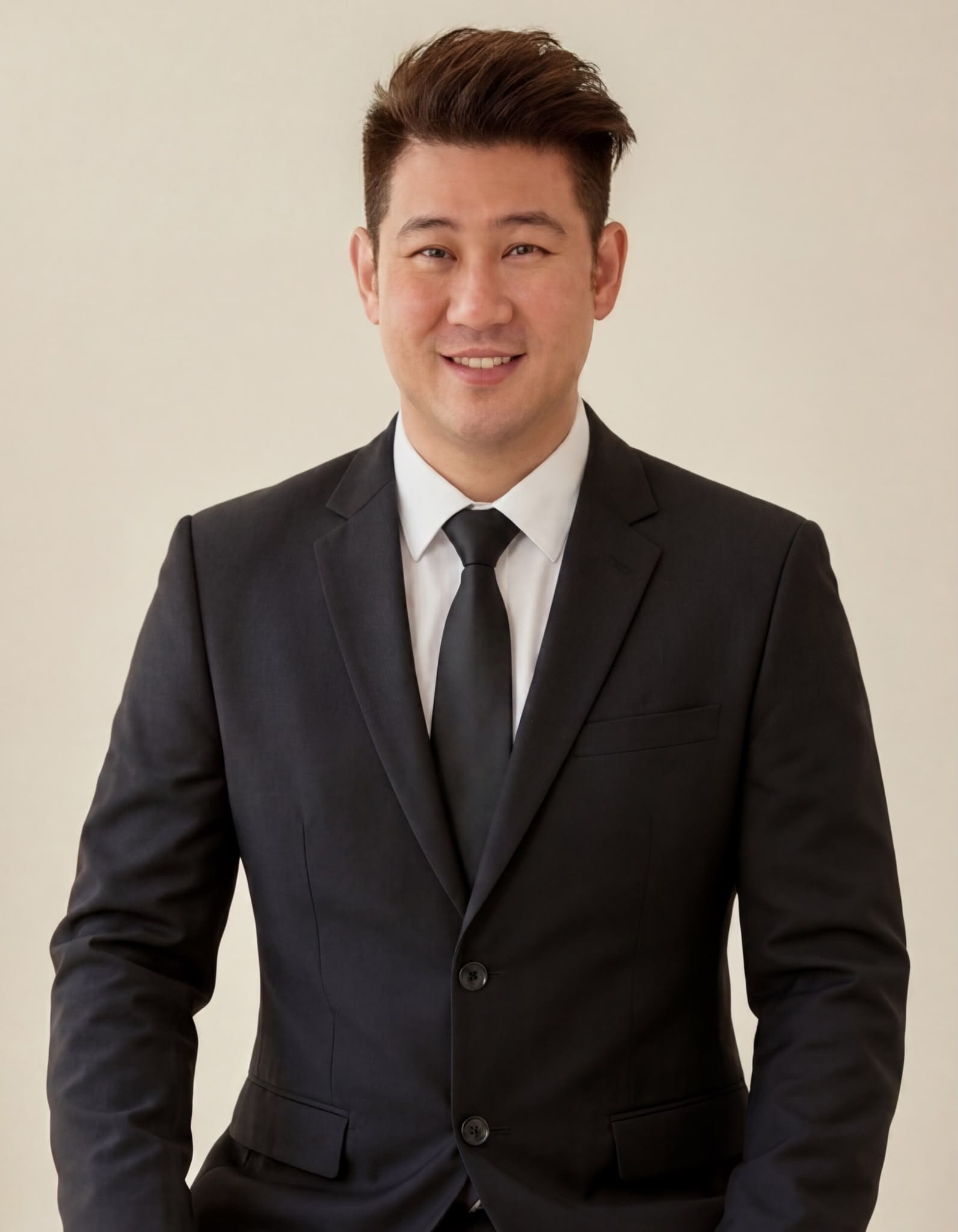 Professional portrait of Derek Woo, Singapore residential property adviser with Huttons Asia