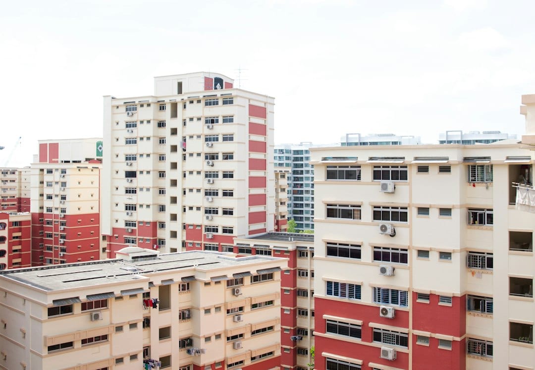Singapore HDB residential neighbourhood with housing blocks under a bright sky